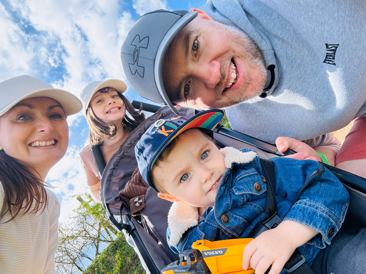Living kidney donor James and his wife and recipient Claire with their two children outside